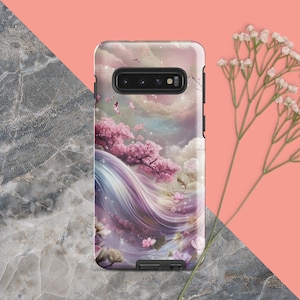May include: A phone case featuring a serene landscape with a waterfall, cherry blossom trees, and birds against a cloudy sky. The case has a black border and a glossy finish, offering protection and a decorative design.
