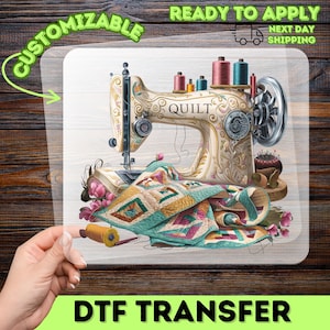May include: DTF transfer featuring a vintage sewing machine with the word "QUILT" on it. The machine is cream-colored with gold accents and spools of thread. A colorful quilt and flowers are also present. The image is labeled "CUSTOMIZABLE" and "READY TO APPLY".