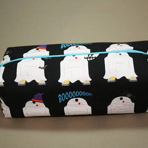 May include: Black zippered pencil case with a white ghost pattern. The ghosts are wearing witch hats and have the text "BOO!" and "BOOOOOO! OOPS!" printed on the case.