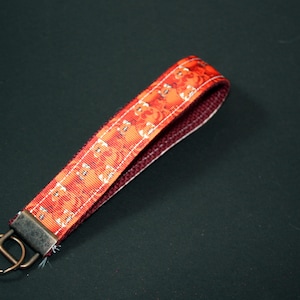 Llavero de pulsera - ¡Es un panda rojo! - Llavero