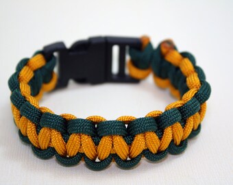 Paracord Bracelet - Green & Gold with Side Release Buckle - Cobra-Fishtail-Criss Cross-Baseball-Cat Claw-Shark Jaw Bone-Dotted Blaze-Duality