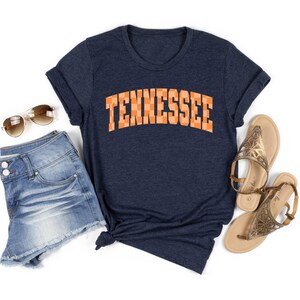 a women's tennessee t - shirt with the word tennessee on it