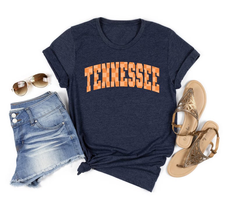 a women's tennessee t - shirt with the word tennessee on it