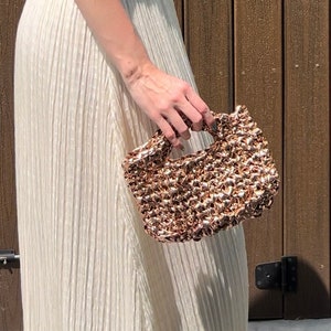 Gold going out bag top