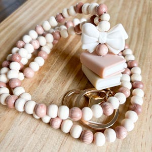 Personalized Rosewood Teacher Lanyard, Books and Bows | breakaway lanyard | Neutral pinks