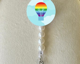 Autism Awareness Badge Reel: Rainbow, Clouds, Light Bulb Charms