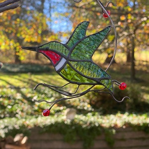 Stained glass hummingbird in flight