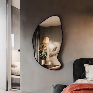 Asymmetrical wall mirror. Model P