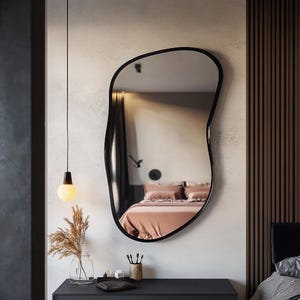 Asymmetrical wall mirror. Model a39
