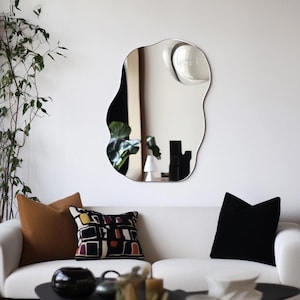 Asymmetrical wall mirror. Model BF