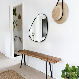 Asymmetrical wall mirror. Model J