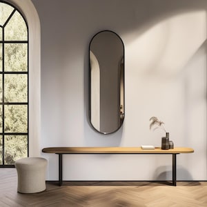 Asymmetrical wall mirror. Model BE