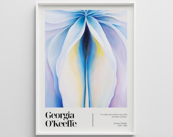 May include: A framed art print featuring a close-up of a flower painting in shades of blue, white, and yellow. The print includes the name "Georgia O'Keeffe" and a quote. The artwork is displayed in a white frame.