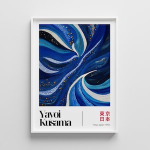 May include: A framed art print featuring an abstract design in shades of blue, white, and black, with small gold accents. The artwork is signed "Yayoi Kusama" with Japanese text and the text "Tokyo, Japan 1970's" at the bottom.