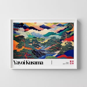 May include: A framed art print featuring a colorful landscape painting. The artwork depicts mountains, trees, and a river in shades of blue, green, orange, and yellow. The artist's name, Yayoi Kusama, is printed at the bottom, along with "Tokyo Japan 1970's".