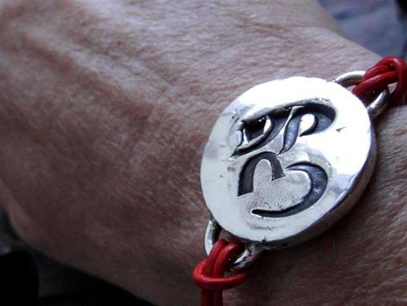 Sterling Silver Om Ohm Sign Bracelet on Red Leather image 5