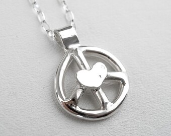 Collar con el símbolo de la paz y corazón fundido en plata de ley
