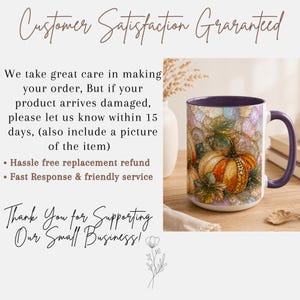 May include: A ceramic mug with a purple interior and handle, featuring a vibrant graphic of an orange pumpkin surrounded by autumn leaves and gold-toned decorative accents. The mug is displayed on a wooden surface next to a white vase and books.
