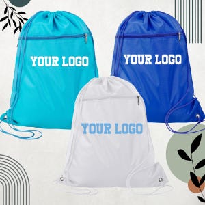 May include: Three drawstring backpacks in turquoise, white, and blue. Each bag has a zippered pocket and the text "YOUR LOGO" printed in white or blue. The bags are designed for carrying items.