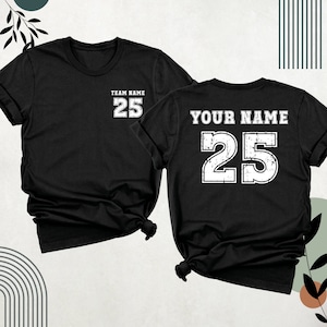 May include: Two black t-shirts with a white number 25 printed on the front and back. The front shirt says "Team Name" above the number. The back shirt says "Your Name" above the number.