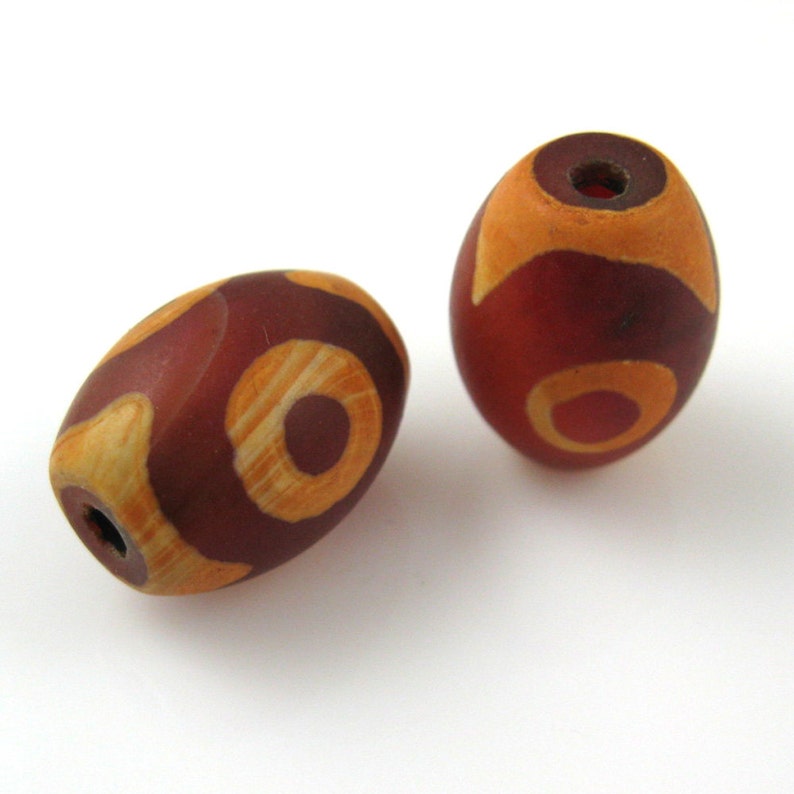 Carnelian dZi bead Oval Shape with 3-Eyes Totem 14 mm by 10 mm 3 pcs SKU: 302073 image 1