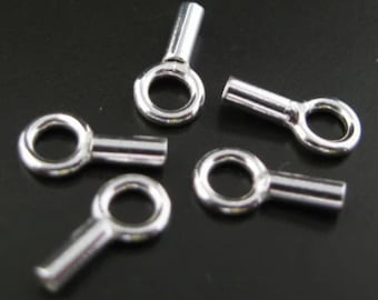 May include: Five silver-toned metal bead tips with a small loop at the top and a long, thin, cylindrical body.