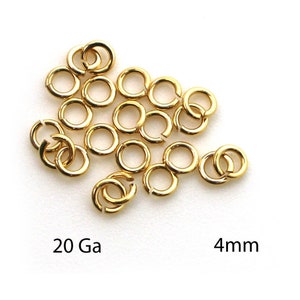 May include: A pile of 20 gauge gold jump rings, each measuring 4 mm in diameter.