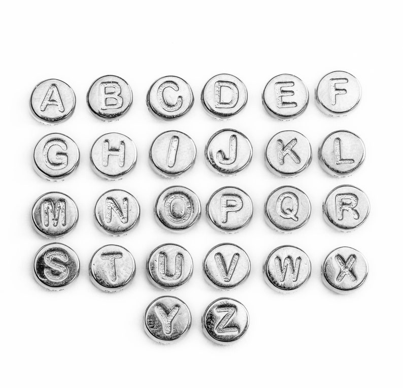 May include: Silver alphabet letter beads, each bead features a letter of the alphabet from A to Z.