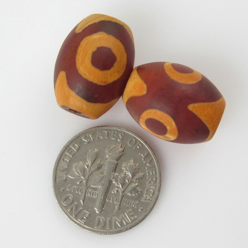 Carnelian dZi bead Oval Shape with 3-Eyes Totem 14 mm by 10 mm 3 pcs SKU: 302073 image 2