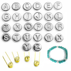 May include: Silver alphabet letter beads, each letter is a separate bead.  A turquoise bracelet with silver accents is also shown.  Three gold necklaces with letter beads are shown spelling out the word "CUT".