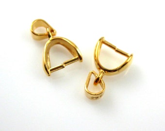 May include: Two gold-tone metal clasps for jewelry making. Each clasp has a loop on one end and a hook on the other end.