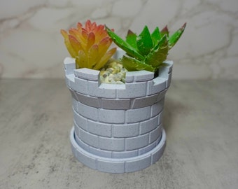 Macetero pequeño con forma de castillo