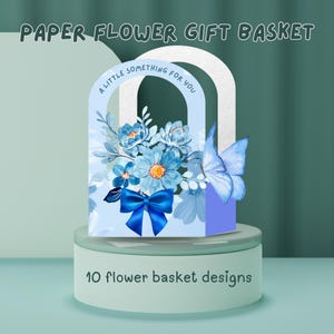 May include: A paper flower gift basket with blue flowers, a blue bow, and a butterfly. The text "A little something for you" is arched above the flowers. The words "10 flower basket designs" are at the bottom.