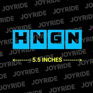 May include: A decal featuring the black letters HNGN centered within four individual bright blue square blocks. Below the letters, a yellow arrowed line indicates a width of 5.5 inches. The background is black with the word JOYRIDE repeated.