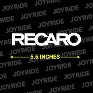 May include: A white RECARO logo centered on a black background with the repeating text JOYRIDE. Below the logo, a yellow arrowed line indicates a width of 5.5 inches. The design features bold, clean typography and high-contrast colors for visibility.