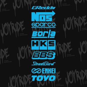 May include: A black background with the words "JOYRIDE MOTORSPORTS" in a graffiti style. Several brand logos are stacked vertically in bright blue, including GReddy, NOS, Sparco, Borla, HKS, BBS, StreetGlow, Enkei, and Toyo.