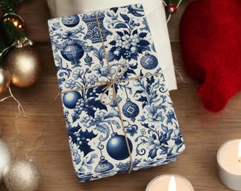 May include: A wrapped gift with blue and white floral and ornament pattern paper tied with twine. The gift is surrounded by Christmas decorations, including ornaments, candles, and a red stocking.