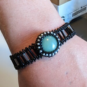 Black and White Beaded Bracelet with Green Stone Cabochon