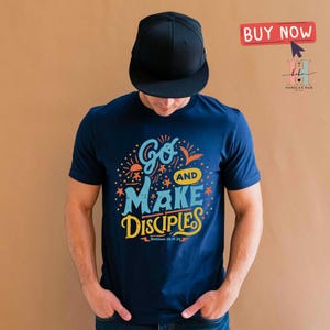 May include: A navy blue t-shirt with a colorful graphic design that says "Go and Make Disciples" with the scripture reference "Matthew 28:19-20".
