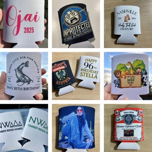 May include: Collection of white and black can coolers with various designs and text. Designs include "Ojai 2025", "Unprotected Sets", "Nashville", a birthday message, a fish graphic, and a photo of a person.