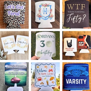 May include: Collection of beverage can coolers with various designs. One features leopard print with "Let's Get Feral". Others include floral designs, birthday messages, and a football field graphic. One says "Varsity".