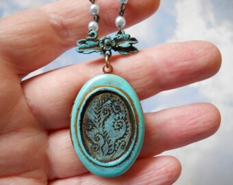 Verdigris Moss Fiddlehead fern engraved art locket on vintage soft blue pearls necklace