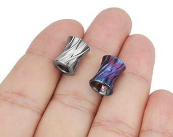 May include: Two metal fidget spinner beads, one silver and one with a blue and purple swirl pattern.