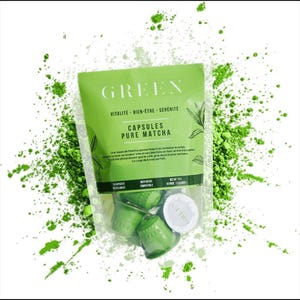 May include: A clear plastic pouch containing green coffee-style capsules labeled GREEN CAPSULES PURE MATCHA, with text including VITALITE-BIEN-ETRE-SERENITE and NET WT 15 G. The pouch is surrounded by a vibrant green matcha powder splash effect.