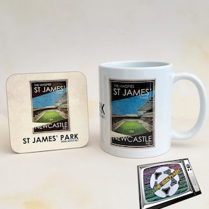 May include: A white mug and coaster with a black and white image of St. James' Park, the home of Newcastle United Football Club. The text "The Magpies St. James' Park Newcastle Net" is printed on both the mug and coaster. A black and white television with a soccer ball and the text "The Goalflash" is also shown.