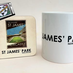 May include: A white ceramic mug with black text that reads "JAMES' PARK NEWCASTLE NE1". A coaster with a vintage image of a football stadium and the text "THE MAGPIES ST JAMES' PARK NEWCASTLE NET" is also shown.