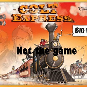 May include: A colourful illustration of a train engine with a red caboose and several passenger cars. The train is travelling through a desert landscape with cacti and mountains in the background. The text "Colt Express" is written in large, bold letters across the top of the image. The text "Big Box" is written in a smaller font in the upper right corner of the image.