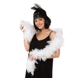 May include: A white feather boa with a black headband and a black dress.