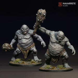 May include: Two grey-skinned troll figurines with textured, rocky skin, wearing tan loincloths with rope belts. One troll holds a large, spiked wooden club overhead, while the other holds a smaller spiked club. Both stand on circular bases with grass.