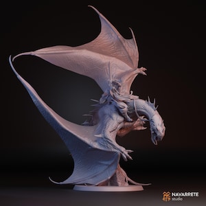 May include: A light grey sculpture of a dragon with a rider. The dragon has large, textured wings and a detailed head. The rider is seated on the dragon's back, holding a sword. The sculpture is set against a dark background. The sculpture is a fantasy art piece.